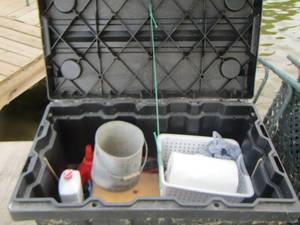 lot 302 image: black outdoor storage box includes lighter fluid, funnels, and more