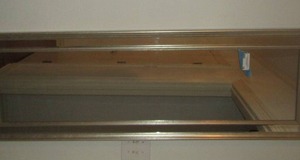 lot 16 image: 54x18 silver frame wall mirror in great condition