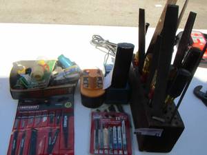 lot 21 image: Craftsman saw blades- Ryobi charger - Makita charger various chizzles- screw drivers, files