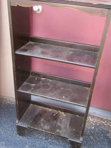 lot 48 image: approx. 4 ft. tall black wooden book shelf needs minor repairs