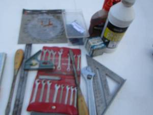 lot 55 image: small wrench set- new saw blade- concrete crack filler- levels and more
