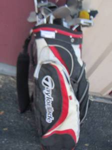 lot 58 image: tailor made golf bag with big tex golf clubs
