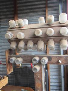 lot 65 image: man made screw bolt and nut spinning holder stand