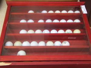 lot 113 image: hanging golf ball case includes 40 golf balls, shelf has corner damage