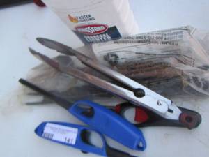 lot 141 image: grill lighters- charcoal fluid and grilling utensils