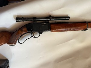 lot 70 image: MOSSBERG & SONS 22 RIFLE  LEVER ACTION WITH SCOPE - HAS SOME  PITTING