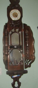 lot 2 image: HAWAIIAN WALL CLOCK 67X24X10 HAS MIRROR DISPLAY BACKGROUND SIDES FOLD IN AND OUT