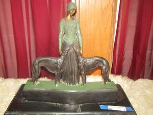 lot 4 image: LADY AND GREY HOUND DOG STATUE HAS CRACK IN MARBLE  BASE 17X19X9