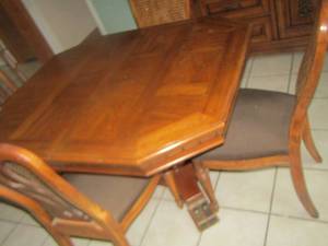 lot 119 image: SOLID WOOD DINING TABLE HAS 3 HIGH BACK WICKER STYLE CHAIRS, HAS DOUBLE STANDARD BASE 29X50X41 TABLE SIZE
