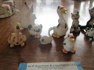 lot 118 image: MINI FIQURINES OF DUCKS,SWANS,SQUIRRELS AND RACOONS