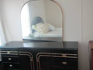 lot 132 image: Black and Gold dresser- 2 door 4 drawer 30x63x16  has mirror attached size 39x38