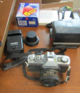 lot 337 image: Polaroid instant camera with new pack of film, Minolta xg-1 camera