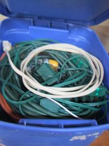 lot 17 image: small blue tote of extension cords