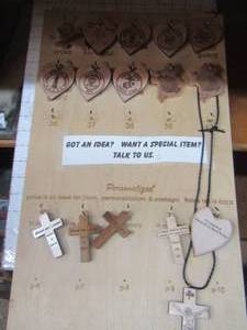 lot 47 image: Display box with crosses, Texas, Harley Davidson, wood examples