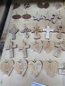 lot 94 image: Display board of small pieces of wooden hearts,  crosses and stars