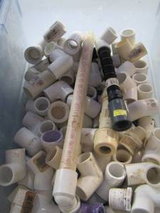 lot 308 image: bucket of pvc piping