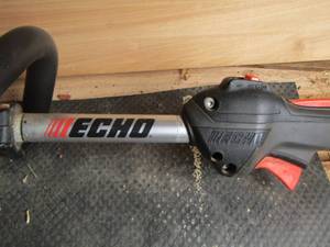 lot 516 image: echo weed eater gas operated, works good