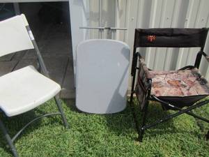 lot 594 image: small fold up table- 2 outdoor fold up chairs 1 is camo 1 is white