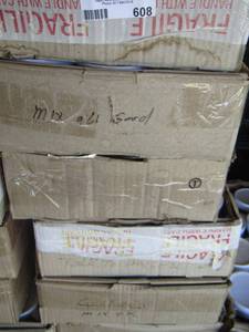 lot 608 image: 9 flat boxes of funny coffee cups with 12 per box
