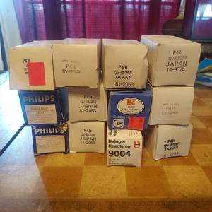 lot 131 image: Assortment of NOS automotive headlight bulbs