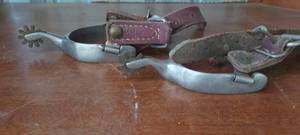 lot 143 image: Vintage pair of stainless steel spurs with 10 tine brass rowell