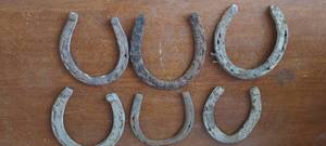 lot 144 image: Lot of old iron horse shoes