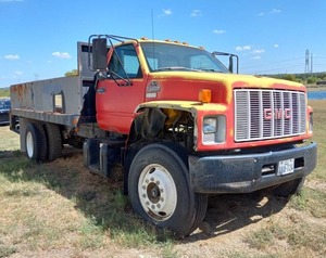 lot 502 image: GMC Top Kick commercial flat bed truck, No keys, No title, Buyer must file for lost or bond title. SEE DESCRIPTION FOR IMPORTANT PICK UP INFORMATION REGARDING THIS ITEM