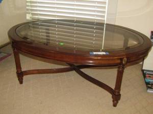 lot 428 image: Gordons glass top wood base oval coffee table