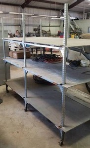lot 112 image: Metal frame rolling storage shelf unit