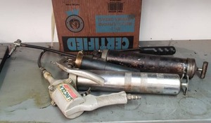 lot 131 image: Lincoln pneumatic grease gun and two manual grease guns plus extra tubes of grease