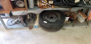 lot 135 image: Contents of shelf including spare tire, tools, hardware and more as shown
