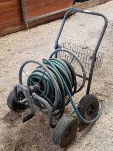 lot 279 image: Rolling Hose Cart w Hose W Storage Basket