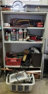 lot 480 image: Metal storage shelf plus contents including electric fence controller, saws, and more as shown