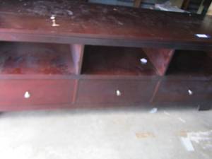 lot 7 image: 3 drawer solid wood entertainment piece 267220 --, has a few scratches on top easy fix