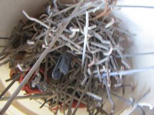 lot 22 image: bucket of peg board hooks