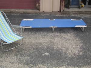 lot 60 image: outdoor chairs- one layout chair and 3 beach chairs