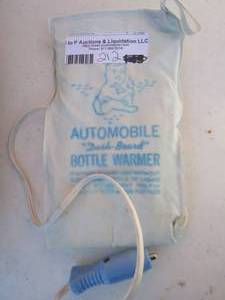 lot 212 image: Automobile Dash board bottle warmer- vintage