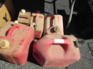 lot 92 image: 1 gallon Kerosine gas  and various gas cans