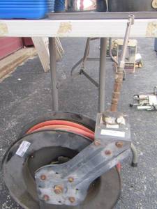 lot 123 image: Tire pressure hose & gauge on roller