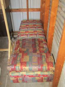 lot 197 image: dark color massage table  bed- comes with pillow in good condition 6ft 19 wide