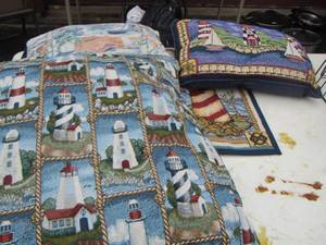 lot 263 image: Tread needle throw pillows, light house design- light house door way rug