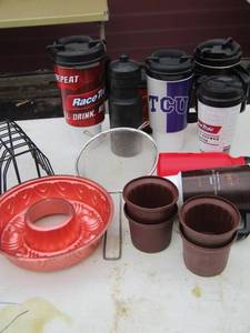 lot 268 image: Various kitchen cups, jell molds, handled strainer