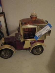 lot 161 image: music liquor decanter, top glass piece is cracked, raise it up and it plays music - wagon design