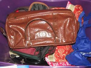lot 206 image: purple tote of various hand bags