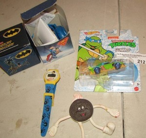 lot 212 image: Ninja turtle hot wheels car new, Batman and Superman watches in original boxes, Alfalfa watch
