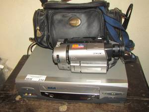 lot 234 image: Sony camcorder with battery and carrying bag,  RCA VHS player