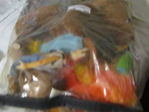lot 290 image: stuffed animals, woody on horse, lisa from the simpsons and more