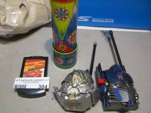 lot 304 image: Transformers walkie talkie, cars flip phone