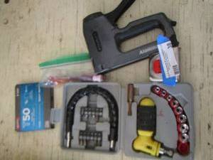 lot 38 image: tool lot, staple gun, tape measure, socket set and wrench and more