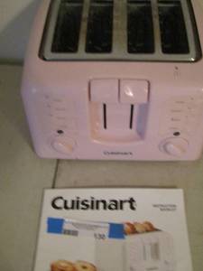 lot 130 image: CUISANART 4 SLICE PINK TOASTER USED